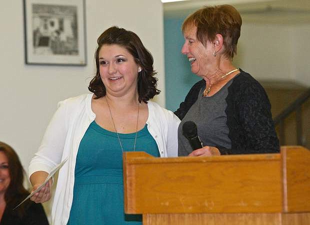 Serena Herup receives an American Association of University Women scholarship from Carolyn Kellog Thursday evening at Carson High School.