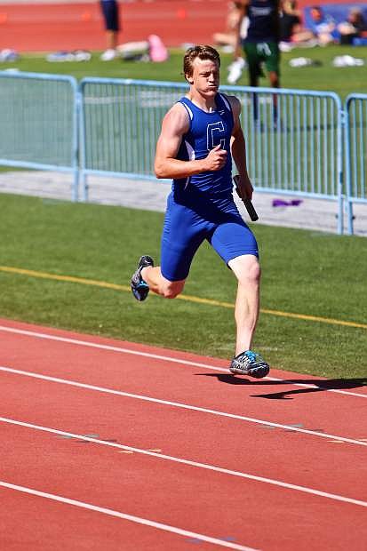 Asa Carter runs the third leg of the 4x400-meter relay Saturday at the Northern Region Trials at Carson High.