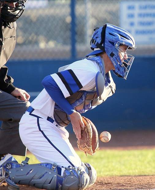 Kyle Krebs makes a catch on a wild pitch in a game against Reed on Tuesday.