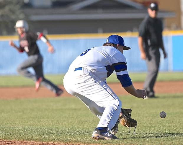 3rd baseman Abel Carter scoops up a Wooster grounder at Ron McNutt Field Saturday.