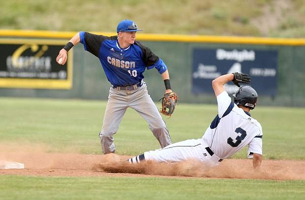 Shortstop Connor Pradere turns a double play in a game against Damonte Ranch on Tuesday.
