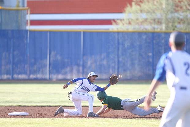 Josiah Pongasi tags out a Manogue base runner on a steal attempt.