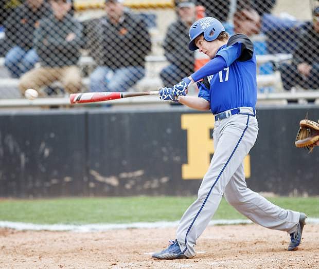 Carson&#039;s Joe Nelson hits a single during the Northern Nevada NIAA League game between Carson High and Galena High at Galena in Reno, Nevada.