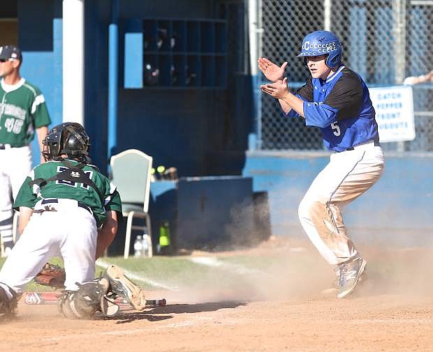 Abel Carter slides safely past the Damonte catcher during a 6th inning Senator rally.