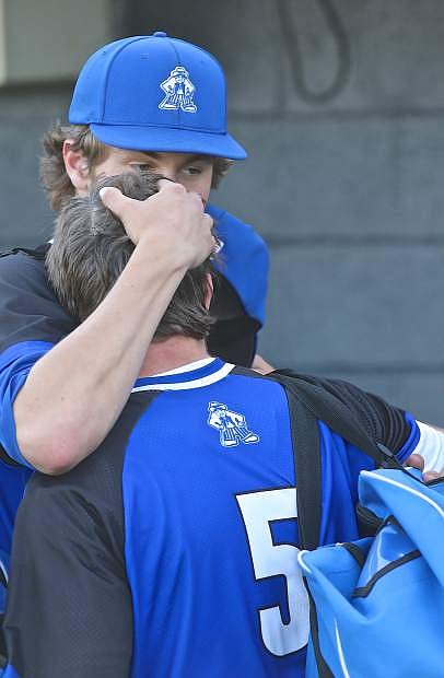 Joe Nelson has a moment with Abel Carter following the Senator&#039;s playoff elimination at the hands of Bishop Manogue Thursday at the University of Nevada&#039;s Peccole Field.