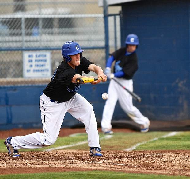 Bluejay Terek Been lays down a sacrafice bunt against McQueen Friday evening at Ron McNutt Field.