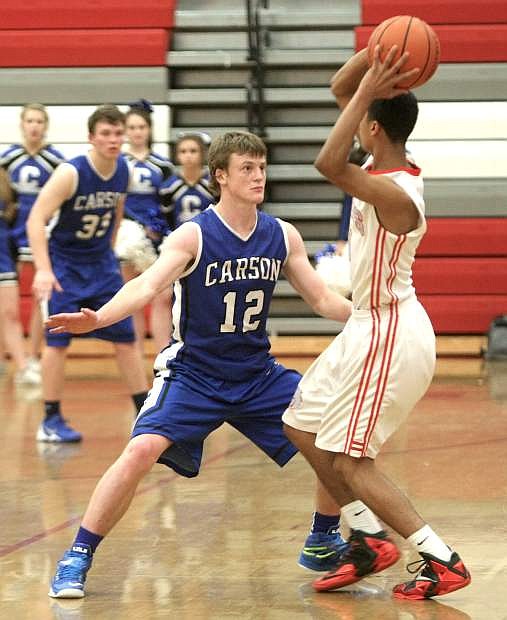 Asa Carter play tight defense against Wooster on Tuesday.
