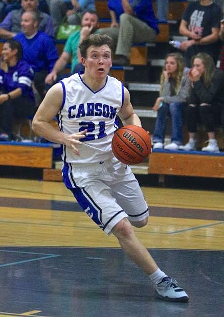 Junior Jace Keema drives to the basket Wednesday night in Carson&#039;s opening quarterfinal game against Reed.