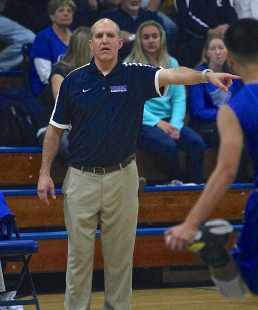 Carson Head Coach Carlos Mendeguia directs his players against Reed Wednesday night at Morse Burley Gymnasium.