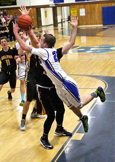 Senator Cameron Price (23) drives against Galena&#039;s Zach Lessinger in a loss to the Grizzies 64-42 at Morse Burley gym Friday night.