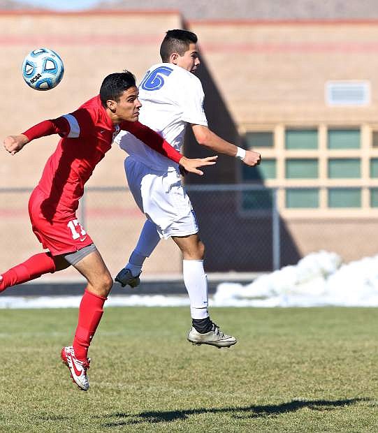 Junior Rogelio Herrera (16) battles a Wooster player during the Division I NIAA Boy&#039;s State Championship game at North Valleys High School Saturday. The Senators went on to win in overtime, 2-1.