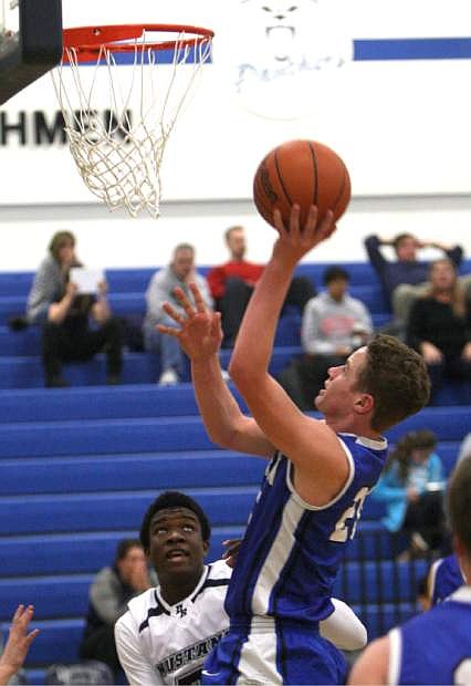 Tez Allen drives to the basket against Damonte Ranch on Tuesday.