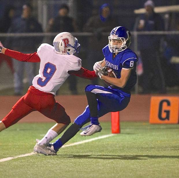 Connor Pradere makes a reception in the endzone in the 3rd quarter for a Senator score against Reno Friday night at Carson High.