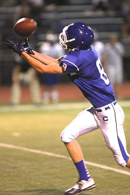 Connor Pradere, CHS receiver, brings in a pass that results in a Carson score Friday night against McQueen.