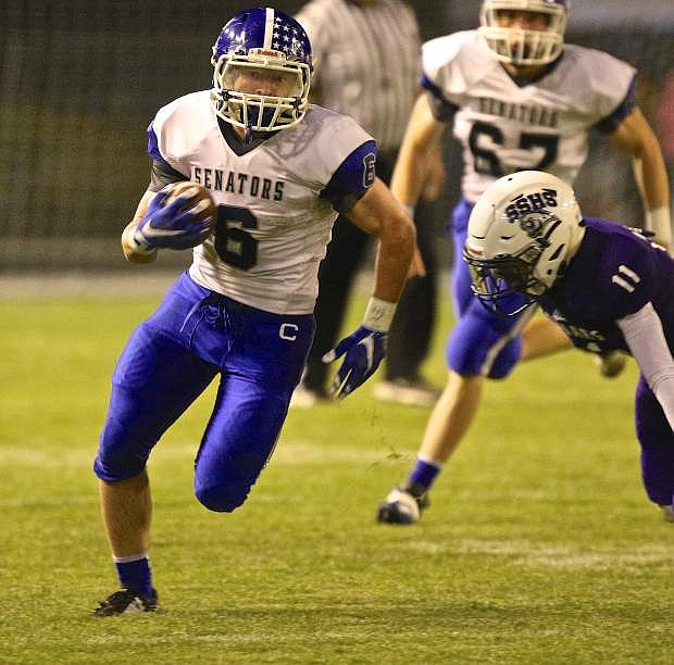 Carson running back Abel Carter rounds the corner on his way to a big gain for the Senators against Spanish Springs Friday night in Sparks.