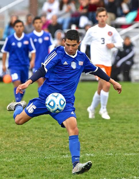 Senator Rogelio Herrera takes a successful shot on goal at Douglas High Wednesday afternoon.