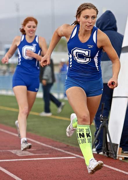 Carson&#039;s Athena Favero runs her leg of the girls 4x400 relay last Saturday in the regional trials at Carson High.