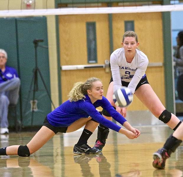 Freshman Abby Pradere goes after a tough dig agains Manogue Thursday night in Reno.