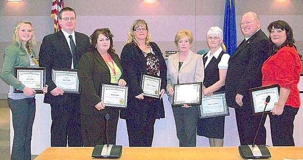 District Attorney Arthur Mallory presents awards of appreciation to the Child Support Unit staff after receiving 100 percent on the Fiscal Year 2013 Federal Self-Assessment audit. From left are student intern Erin Nelson, Wade Carner, Brenda Ogden, Lonnie Montgomery, Debbie Juliff, Naomi McArthur, Mallory and Brenda Mahan.