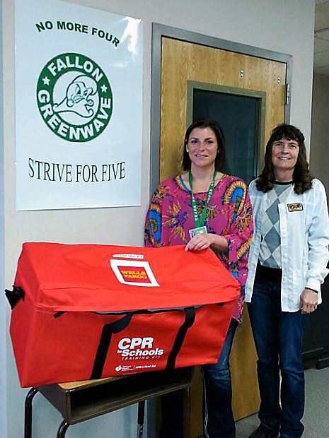 Churchill County Middle School seventh grade health Natalie Warga and  Churchill County Middle School Nurse Gayle Martin show a new CPR kit donated by Wells Fargo and the American Heart Association.