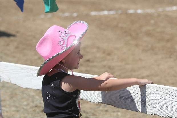 Four-year-old Zoey Brown watches the races at the International Camel and Ostrich Races in Virginia City on Friday.