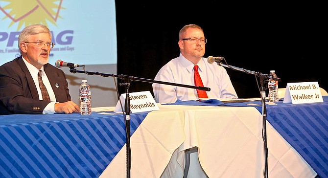 School Board trustee candidates Steven Reynolds and Michael B. Walker speak at the Brewery Arts Center Wednsday evening.