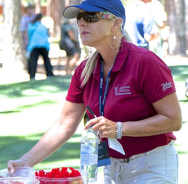 &quot;Candy Lady&quot; Mary Del Monte arranges her table of treats for players at the ACC Friday at Edgewood Tahoe.