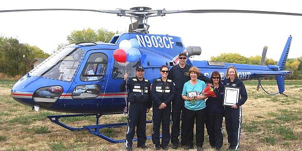 A Care Flight team from Truckee presented Barbara Evans with an award and gifts for the action she took on an unlit microwave tower.
