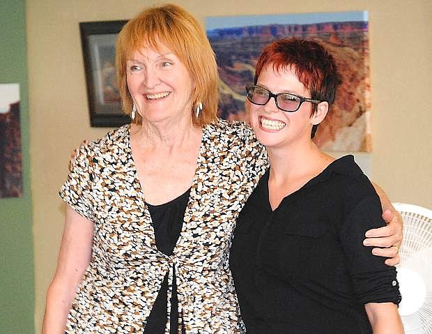 Rising Sun Gallery and Art Studios owner Patricia Sammons, left, and former LVN reporter Stephanie Carroll share a hug Sunday after Carroll&#039;s reading of her new novel, &quot;A White Room.&quot;
