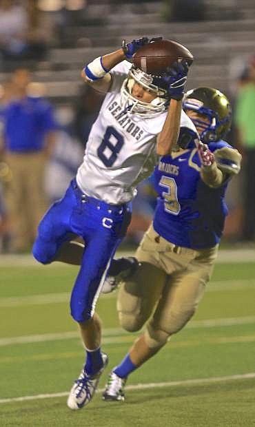 Carson receiver Connor Pradere hauls in a pass to set up a touchdown against the Reed Raiders Saturday night in Reno.