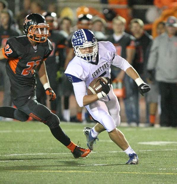 Chase Blueberg runs past a Douglas defender during a game in early November.