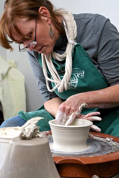 Linda Ritter of Pinyon Pottery works clay on the potter&#039;s wheel Saturday afternoon at the Carson City Chamber of Commerce&#039;s &#039;Meet The Artist&#039; event at the Chamber Artisan Store at 1900 S. Carson St.