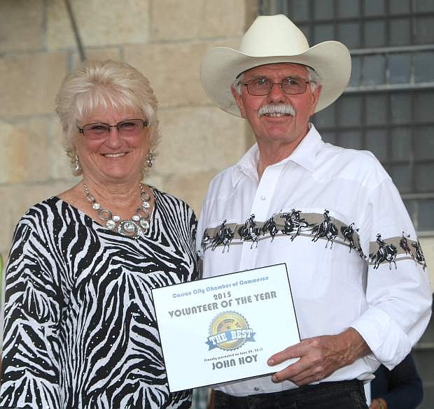 Chair Terrie McNutt presents John Hoy with the Chamber&#039;s Volunteer of the Year award on Monday.