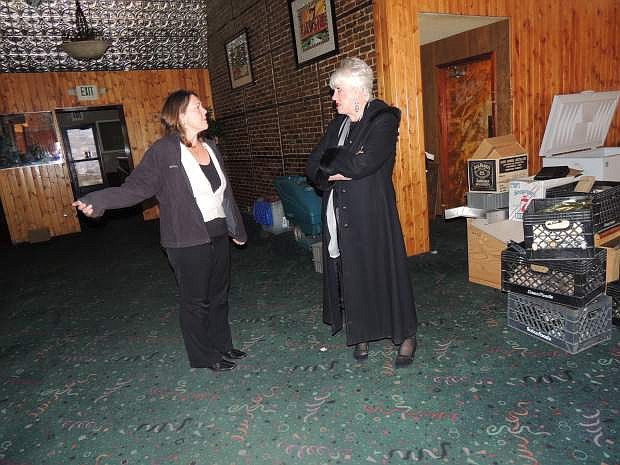 Jeanette Kelley, left, talks with Carson City Chamber of Commerce Director Ronni Hannaman on Monday.