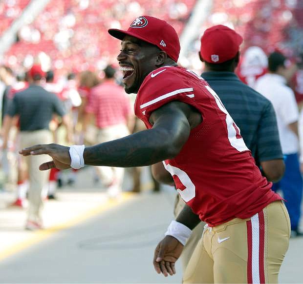 San Francisco 49ers tight end Vernon Davis celebrates on the sideline during the fourth quarter of an NFL preseason football game against the San Diego Chargers in Santa Clara, Calif., Sunday, Aug. 24, 2014. The 49ers won 21-7. (AP Photo/Marcio Jose Sanchez)