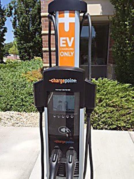A new electric vehicle charging station and designated parking spaces are seen at the Bryan Building in Carson City.
