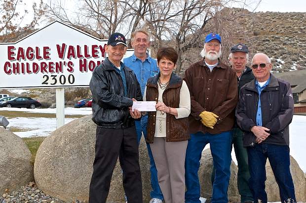 The Dayton Knights of Columbus from St. Anne&#039;s Catholic Church in Dayton donate $1,600 on Thursday to the Eagle Valley Children&#039;s Home from their annual Tootsie Roll Drive. Pictured here are Ken Broadway, EVCH Exec. Director Beverly Hennen, Gene Kinney, Gene Ray, Patrick Neylan and Vincent DeCasper.