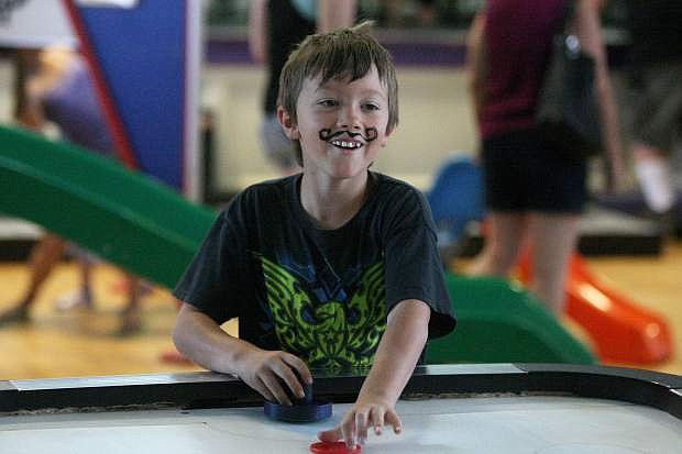 Six-year-old Tyler Kotik plays with bubbles on Saturday at the Children&#039;s Museum of Northern Nevada 25th anniversary celebration.