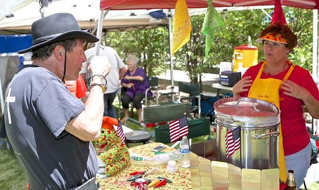 Dr. Gary Santora is served some Wow Wow Chili by Toni Groth Saturday at the International Chili Society&#039;s High Sierra Regional Chili Cookoff. The event is a fundraiser for Honor Flight.