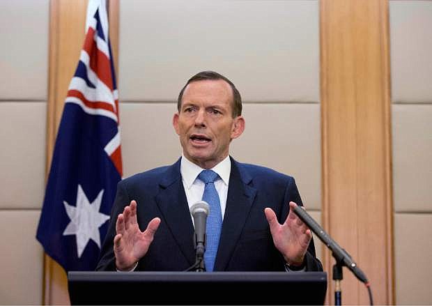 Australian Prime Minister Tony Abbott speaks during a press conference at a hotel in Beijing, China Saturday, April 12, 2014. Abbott told Chinese President Xi Jinping during their meeting on Friday that he was confident signals heard by an Australian ship towing a U.S. Navy device that detects flight recorder pings are coming from the missing Malaysian Airlines Flight 370. Officials believe the plane flew off course for an unknown reason and went down in the southern Indian Ocean off the west coast of Australia. (AP Photo/Andy Wong)