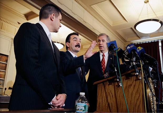 New Jersey Assemblymen John S. Wisniewski, right, D-Sayreville, N.J., and Loius D. Greenwald, left, D-Vorhees, N.J., listen as incoming Assembly Speaker Vincent Prieto, D-Secaucus, N.J., address the media. Monday, Jan. 13, 2014, in Trenton, N.J. The group announced a new special legislative committee will be tasked with finding out how high up New Jersey Gov. Chris Christie&#039;s chain of command a plot went that was linked through emails and text messages to a seemingly deliberate plan to create traffic gridlock in a town at the base of the George Washington Bridge after its mayor refused to endorse Christie for re-election. (AP Photo/Mel Evans)