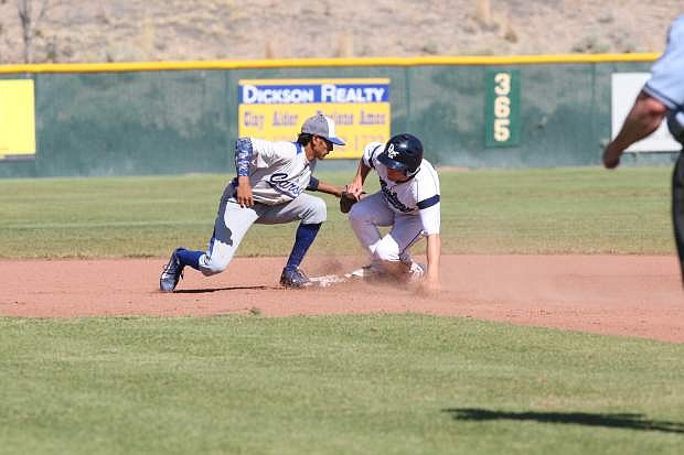 Josiah Pongasi puts the tag on a Damonte player Wednesday afternoon at Damonte Ranch High School.