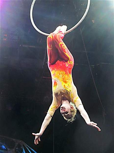 In this undated  family photo, Samantha Pitard performs a heel hang from the lyra (aerial hoop) during the Ringling Bros. and Barnum &amp; Bailey Legends pre-show. Pitard was one of eight acrobats performing a hair-hanging stunt on Sunday May 4, 2014 during a Ringling Bros. and Barnum &amp; Bailey circus when a clip at the top of the chandelier-like apparatus snapped. Pitard was the first of the acrobats to be released from the hospital. (AP Photo/Wayne T. Pitard)