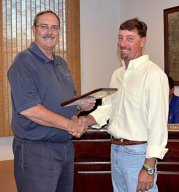 Scott Baker, right, receives congratulations from Mayor Ken Tedford Jr. as the city of Fallon Employee of the Quarter Tuesday.