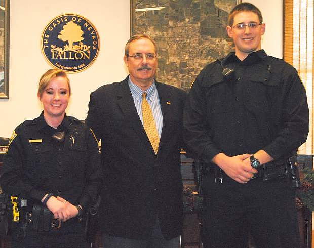 On Monday Mayor Ken Tedford Jr. swore in two new poliece officers for the city of Fallon&#039;s Police Department. From left are Jessica Zamora, Tedford and Christopher Bloomfield.