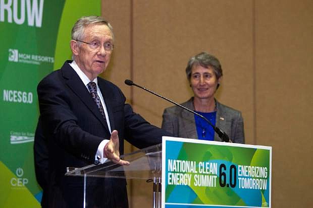 Senate Majority Leader Harry Reid, D-NV,  responds to a question about the stalled Yucca Mountain nuclear waste storage facility during a news conference at the National Clean Energy Summit 6.0 at the Mandalay Bay Resort in Las Vegas Tuesday, Aug. 13, 2013. Interior Secretary Sally Jewell listens at right. (AP Photo/Las Vegas Sun/Steve Marcus)