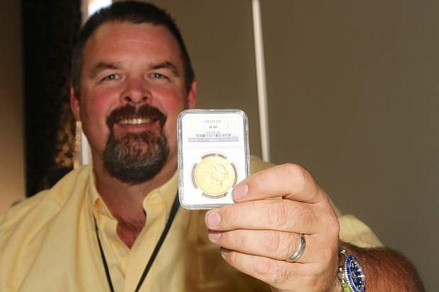 Allen Rowe of Northern Nevada Coin shows a 70cc $20 gold coin valued at $268,500 on Friday at the Carson Nugget.