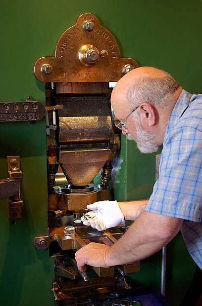 Volunteer Ken Hopple will operate the historic Coin Press No. 1 from the U.S. Mint at the Nevada State Museum&#039;s National Coin Week celebration April 25-26.