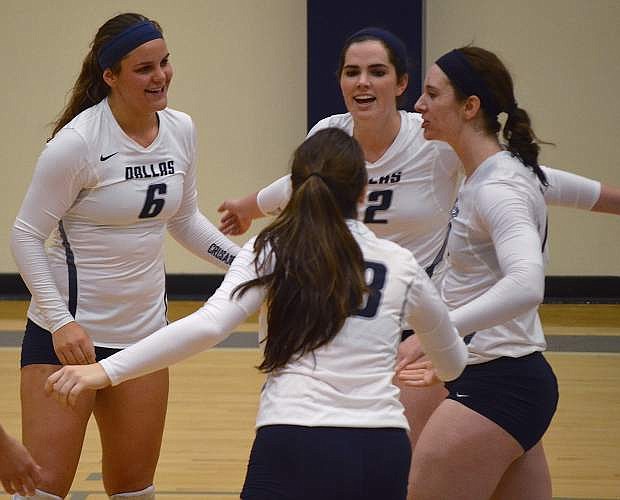 Former Fallon volleyball standout Mary Scholz, left, celebrates with her teammates during a match this season for the University of Dallas.