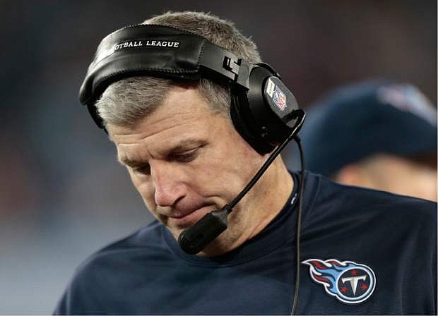 Tennessee Titans head coach Mike Munchak walks on the sideline in the fourth quarter of an NFL football game between the Titans and the Indianapolis Colts Thursday, Nov. 14, 2013, in Nashville, Tenn. The Colts won 30-27. (AP Photo/Wade Payne)